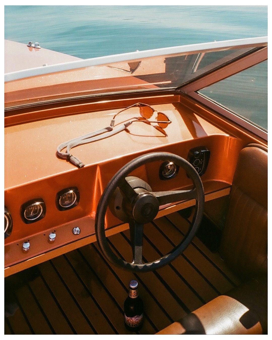 Vintage boat cockpit on the water